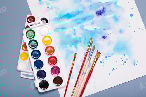 Preview: Top view of work process of watercolor paper pad, watercolor painting supplies and brushes