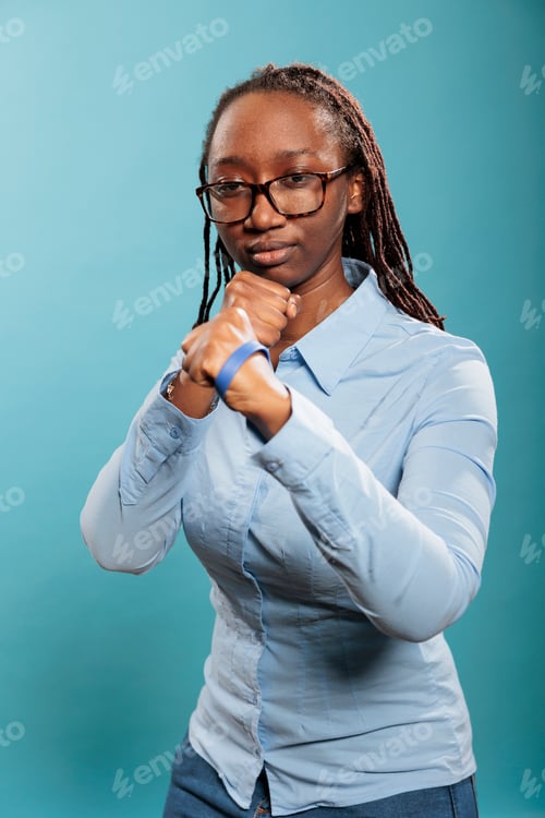 Preview: Defensive young adult person in self defense pose when encountering a life threat.