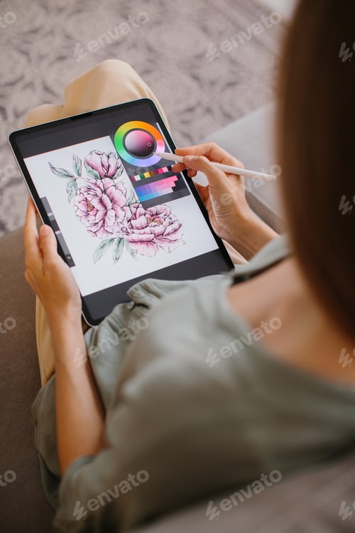 Preview: Designer making new project, drawing on a graphic tablet with pencil, close-up on a screen.