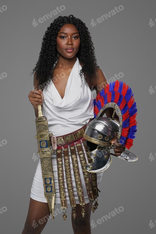 Preview: African American woman wears Roman-style gown with an ornate belt hold helmet