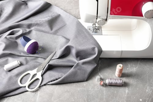 Preview: Sewing Machine with Grey Fabric and Sewing Supplies