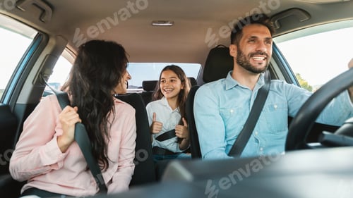 Preview: Auto purchase and rent. Happy caucasian family driving new automobile having test drive in city