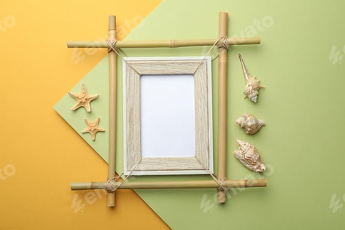 Preview: Empty bamboo frame, starfishes and seashells on color background, flat lay