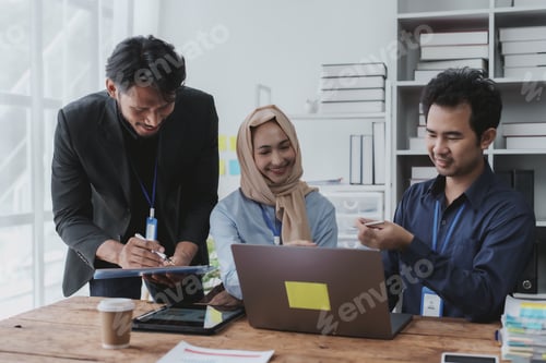 Preview: Group of young Asian business people talk, consult, discuss working