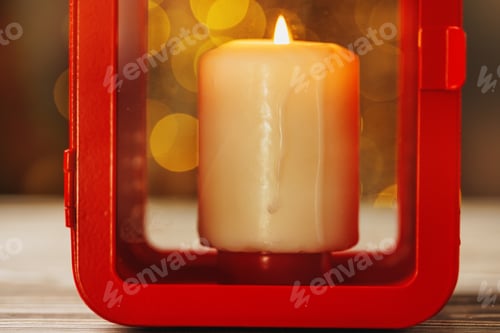 Preview: Christmas red lantern with burning candle on wooden table