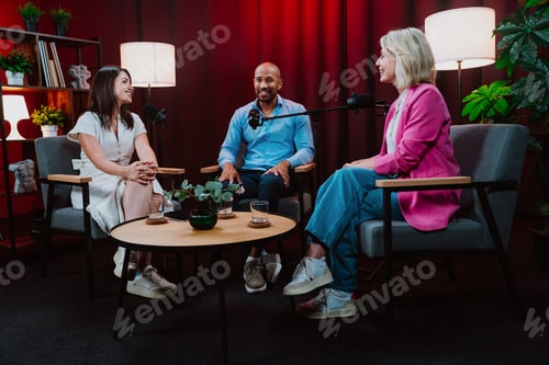 Preview: Content creators broadcasting live podcast interview using microphones