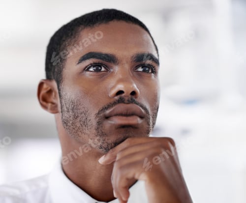 Preview: Hmm.. now let me consider that. Shot of a young businessman looking thoughtful.