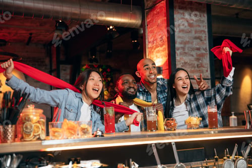 Preview: Group of friends watching sport match together. Concept of friendship, leisure activity, emotions