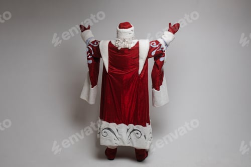 Preview: Father Frost with raised arms from behind.