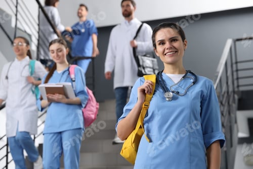 Vista previa: Portrait of medical student with stethoscope on staircase in college, space for text