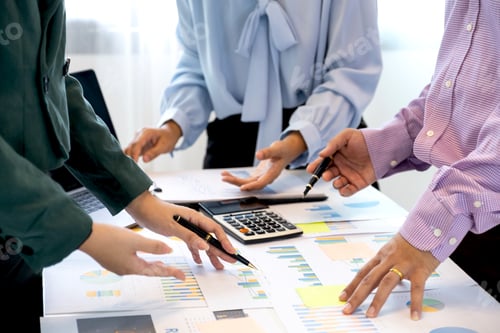 Preview: businesswomen and businessmen team meeting to plan strategies to increase business income.