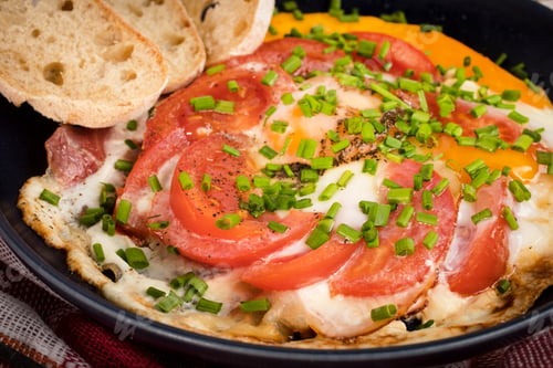 Preview: Homemade breakfast fried egg with tomato.