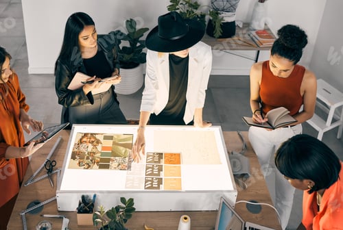 Preview: Perfection must be attained. Shot of a group of designers collaborating at a workshop together.