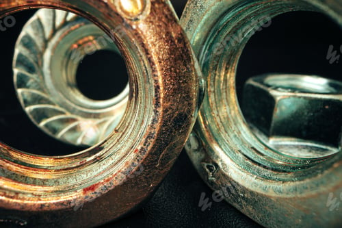 Preview: Metal nut on black background close up