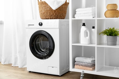 Preview: Modern white washing machine in a laundry room