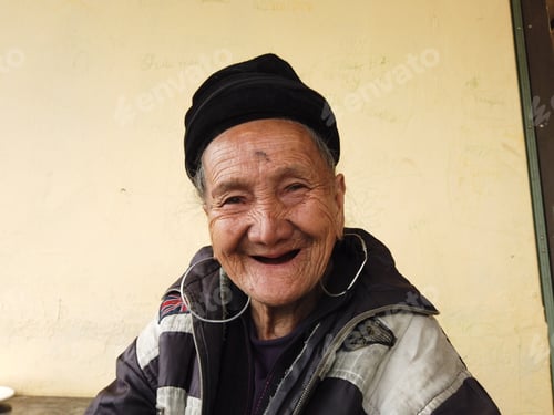 Preview: Smiling Senior Woman with Hoop Earrings Portrait