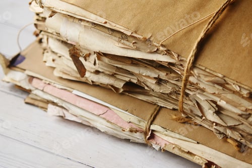Preview: stack of Old papers on table
