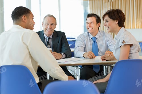 Preview: Smiling businesspeople in meeting