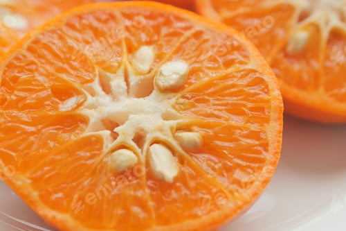 Preview: close up of slice of orange fruit in a bowl