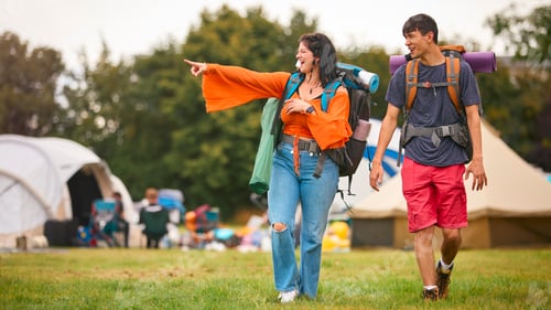 Preview: Young Couple Meeting At Summer Music Festival With Camping Equipment