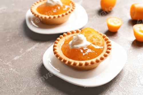 Preview: Tasty tartlets with jam on grey background