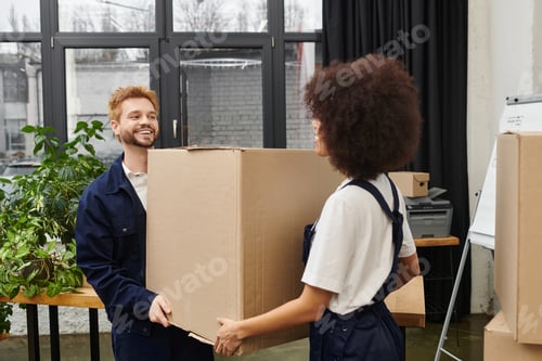 Preview: Joyful moments of packing and unpacking during a modern move in a vibrant workspace