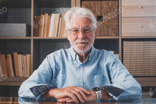 Preview: Portrait of one old cheerful male senior smiling having fun at home. Mature caucasian man