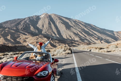 Preview: Woman traveling by car on the volcanic valley