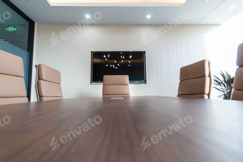 Preview: Modern conference room with a large wooden table and numerous chairs with good lightning