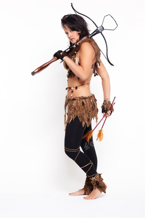 Preview: Full-Length Portrait Of Beautiful Woman Fur Hunter With Crossbow On Gray