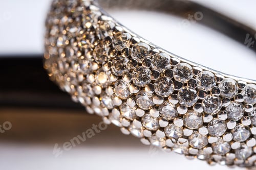 Preview: Ring with beautiful shiny diamonds on light background, macro view