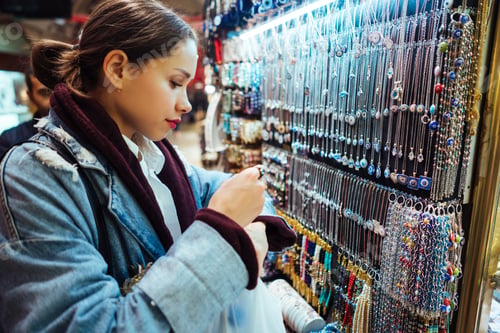Preview: Young girl tourist walking in the souvenir market