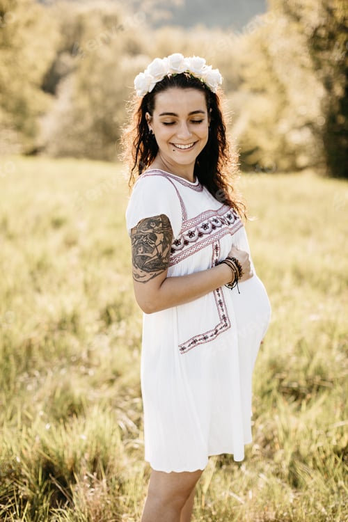 Preview: Happy mother to be enjoying a moment in the nature