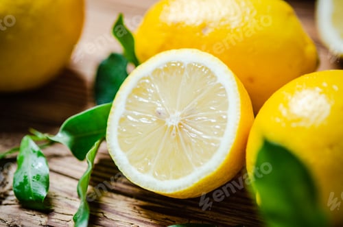 Preview: Fresh lemons. On wooden table.
