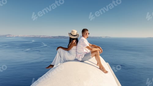 Preview: Santorini Greece, young couple of men and woman on luxury vacation at the Island of Santorini