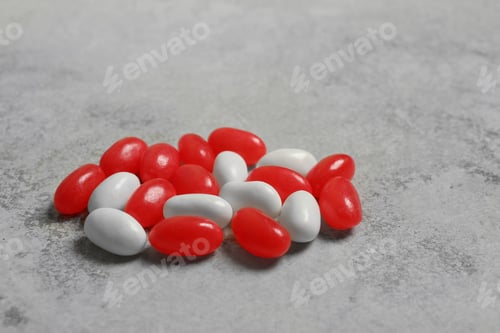 Preview: Delicious bright jelly beans on stone background, closeup