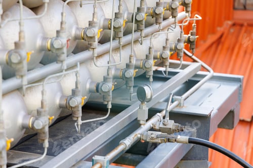 Preview: A lot of bottles filled with gas or gasoline are stacked in piles