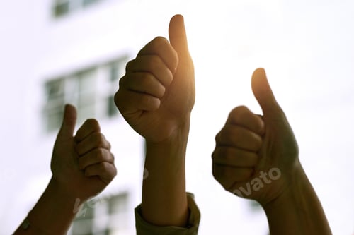 Preview: Youve got their approval. Cropped shot of three coworkers hands giving the thumbs up.