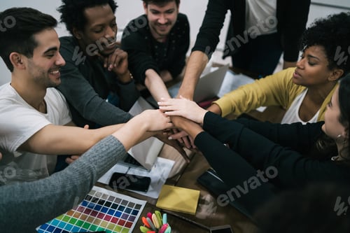 Preview: Team of work showing unity with their hand together.