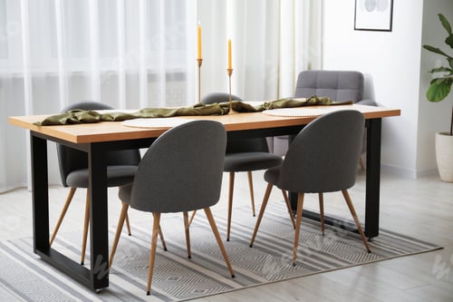 Preview: Decorated wooden table with chairs in dining room