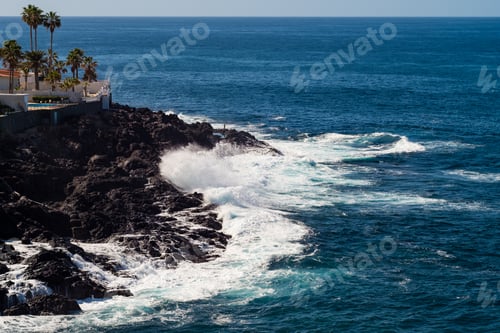Preview: beautiful view on blue ocean water and rocky coast line