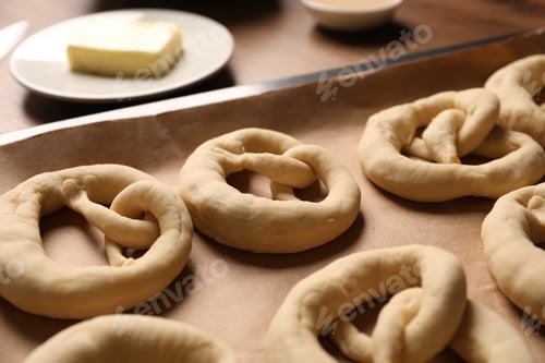Preview: Uncooked pretzels and ingredients on table, closeup