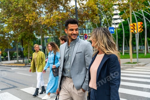 Preview: Diverse business people walking across city street crosswalk