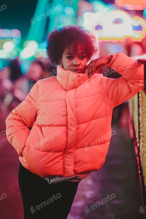 Preview: Black woman standing on night city street