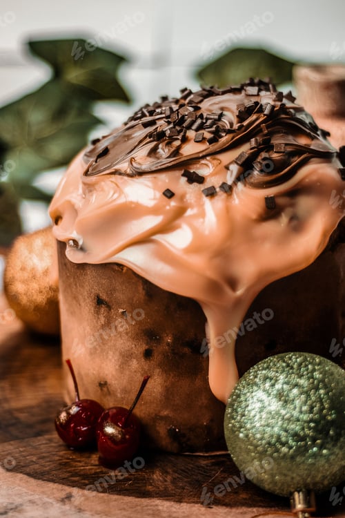 Preview: a chocolate cake sitting on top of a cutting board near christmas decorations
