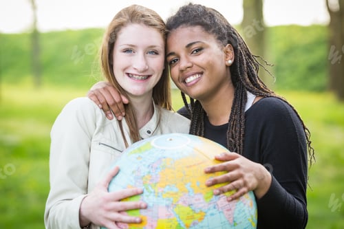 Preview: Multiracial Girls Holding Globe Map