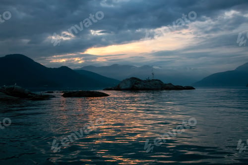 Preview: View of rocky islands with birds during sunset