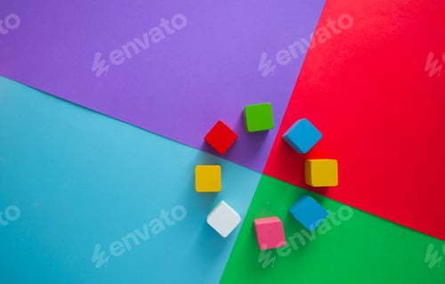 Preview: Colorful cubes on a vibrant multicolored background for a creative project