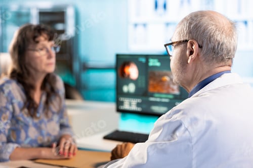Preview: Senior skilled medic and woman patient engage in a medical consultation