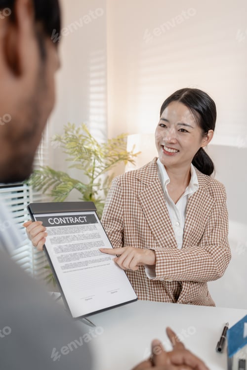 Preview: A real estate agent discusses property contracts with a client
